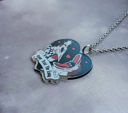 Beetlejuice Necklace with Adam and Barbara.