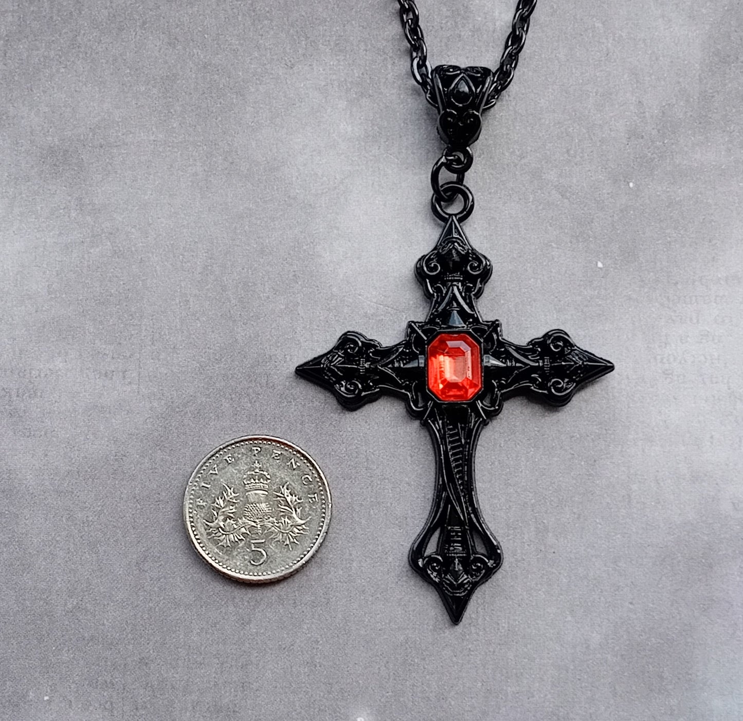 Black Patterned Cross with Red Stone