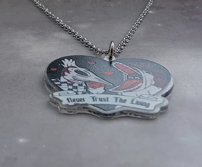 Beetlejuice Necklace with Adam and Barbara.