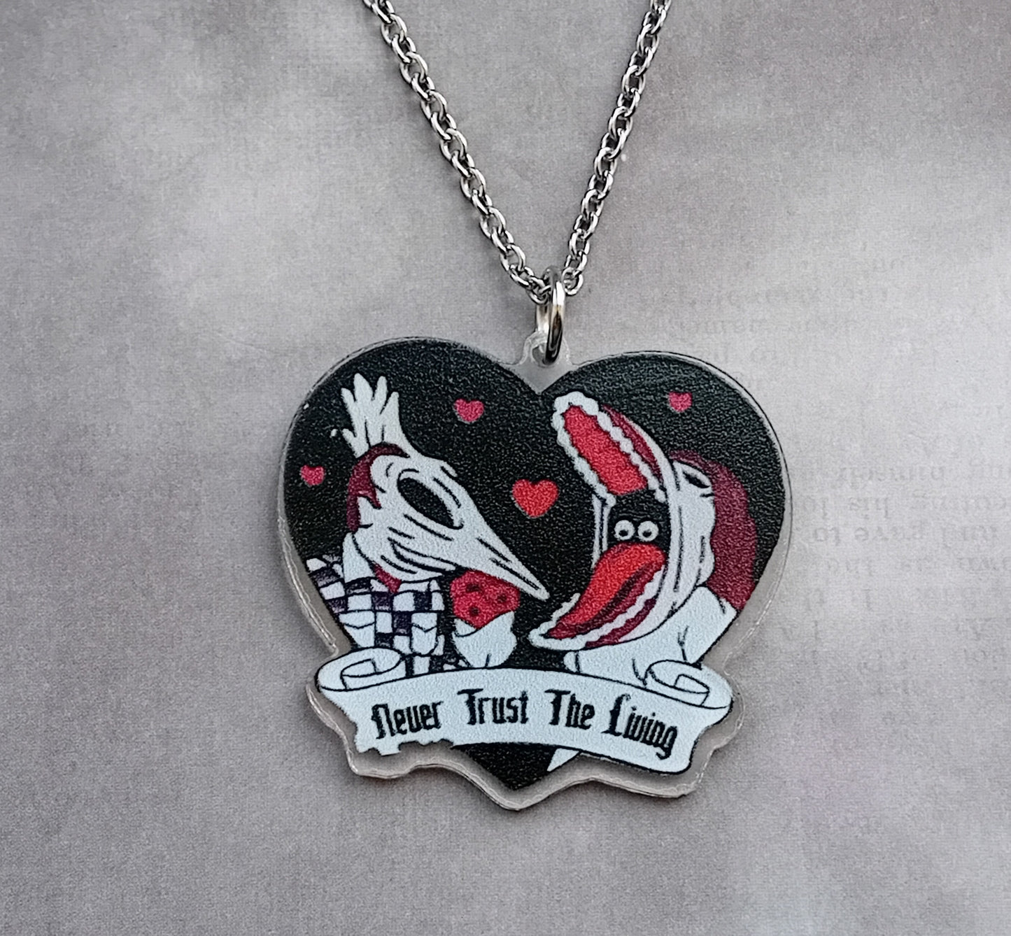 Beetlejuice Necklace with Adam and Barbara.