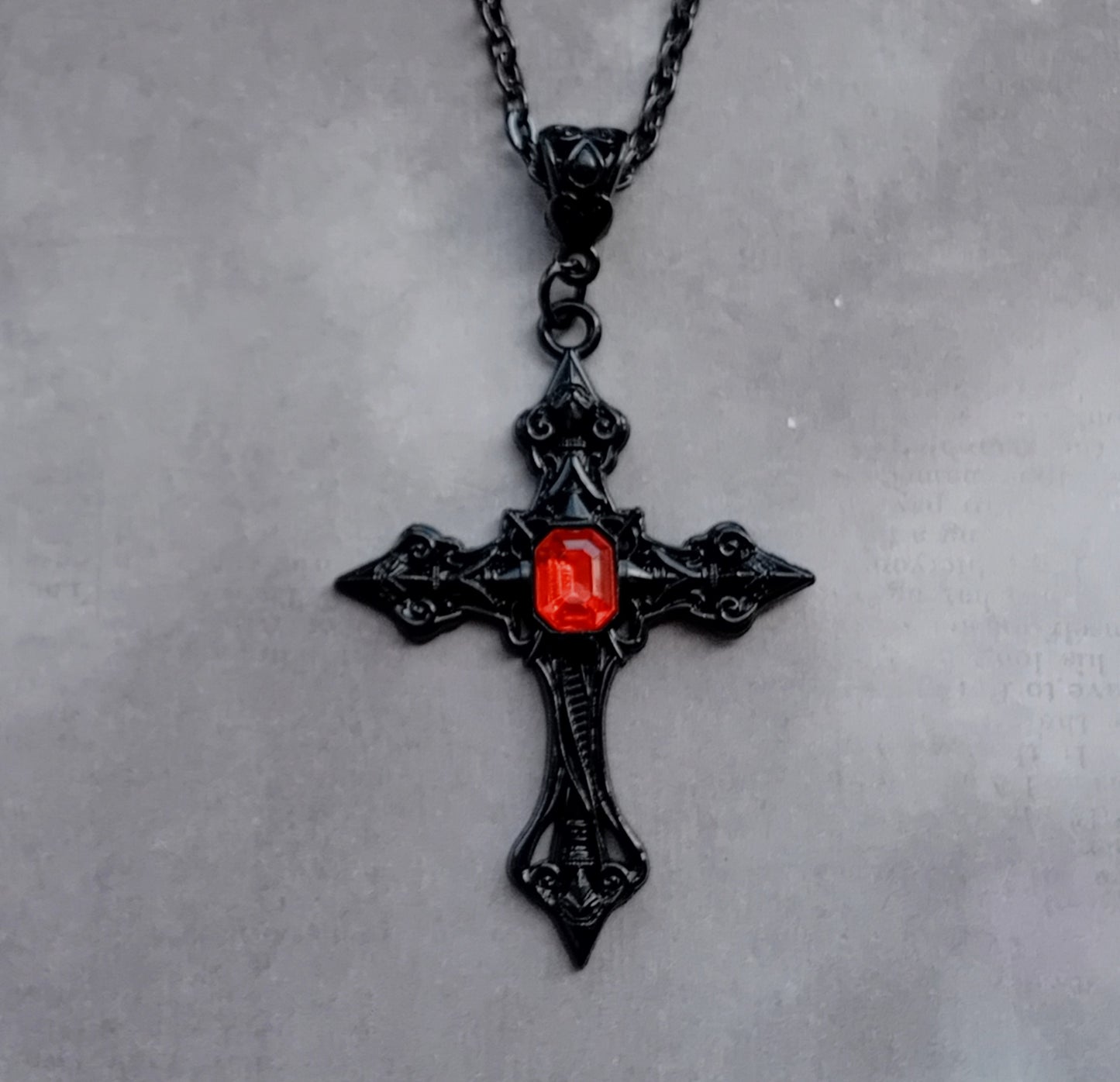 Black Patterned Cross with Red Stone